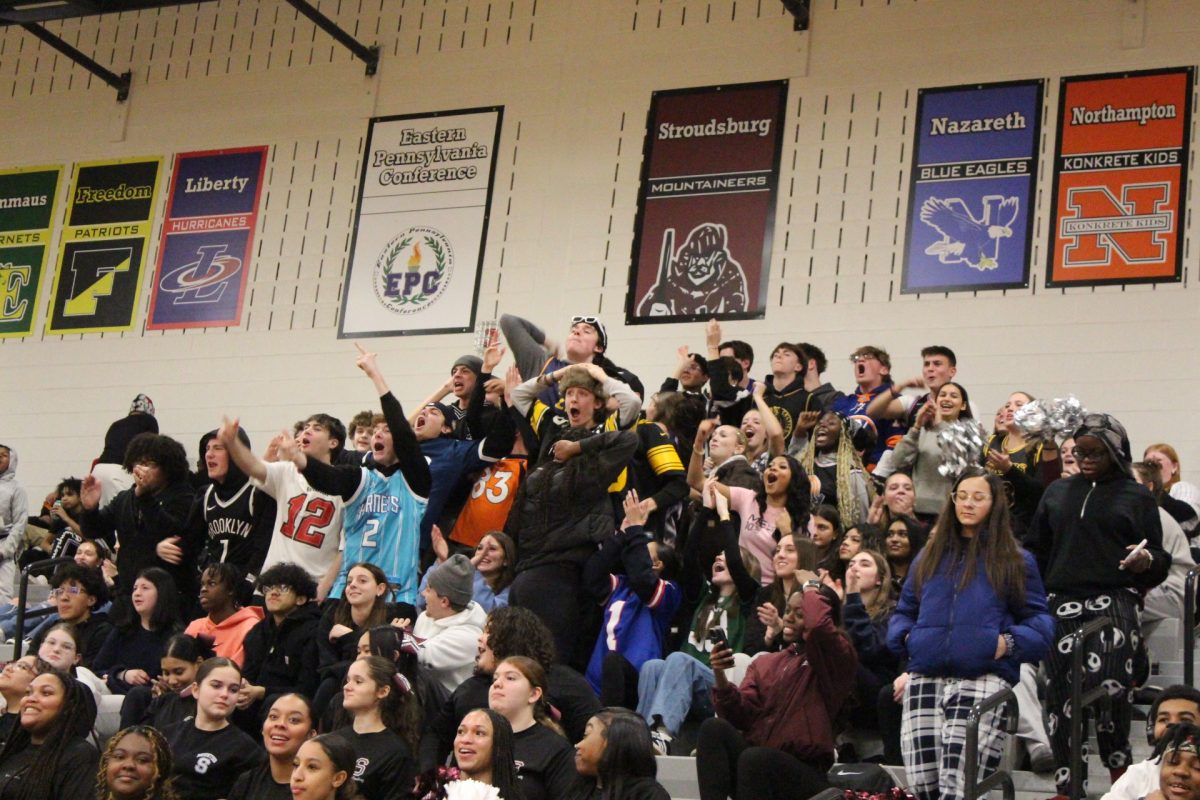 The student section shows their excitement after 2 back-to-back 3-pointers.