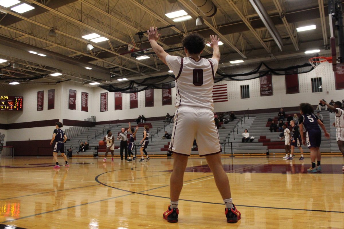 Alex Pacitti, '25, signals for the ball.