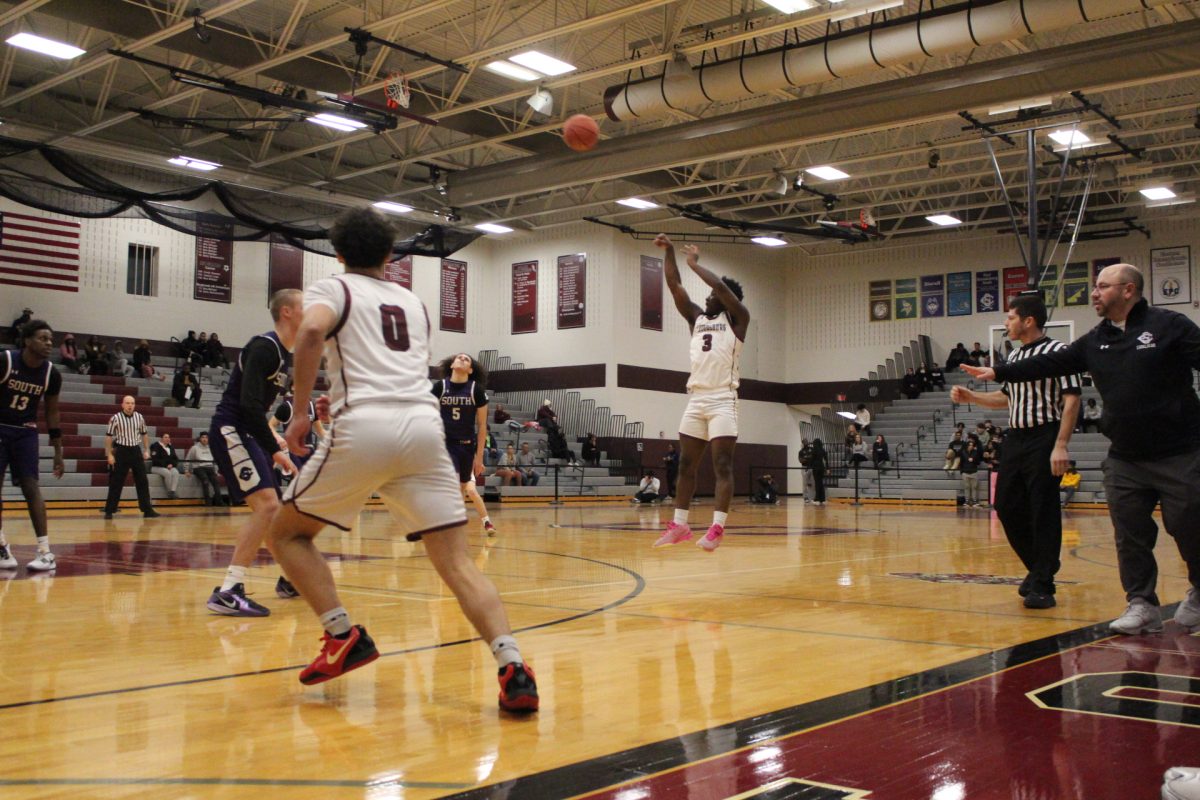 Kam Knight, '26, shooting a 3-pointer.