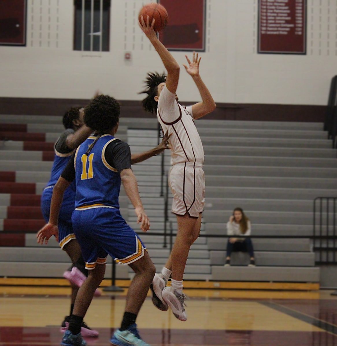 Brandon Quintana, '27, making a lay up