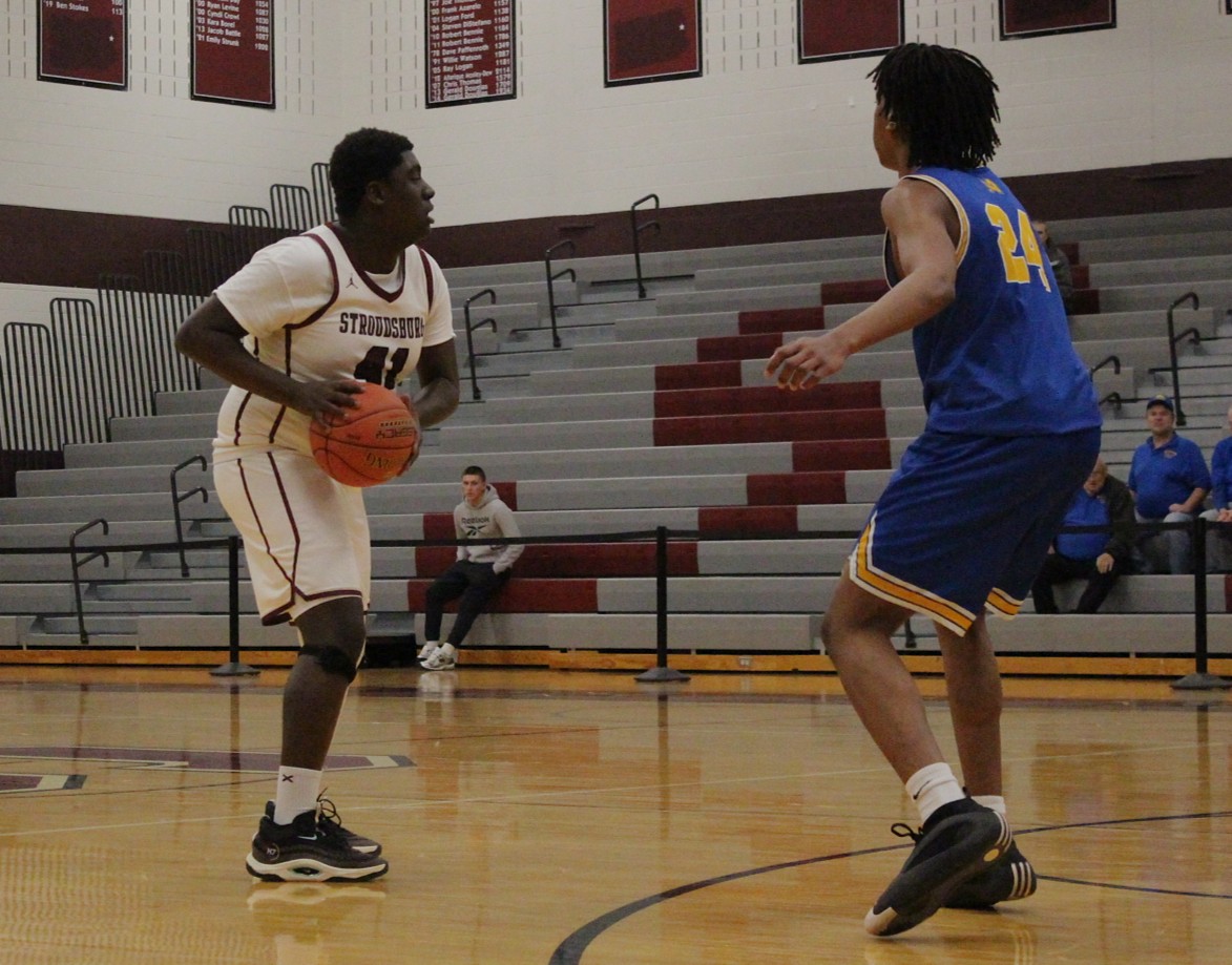 Amari Lewis, '26, holding the ball.