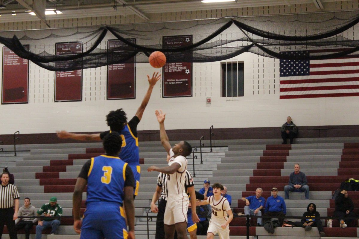 Josh Ivers-Green, '27, at the tip-off.