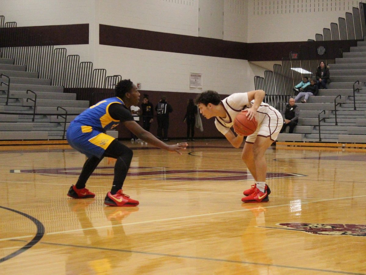 Alex Pacitti, '25, holding the ball