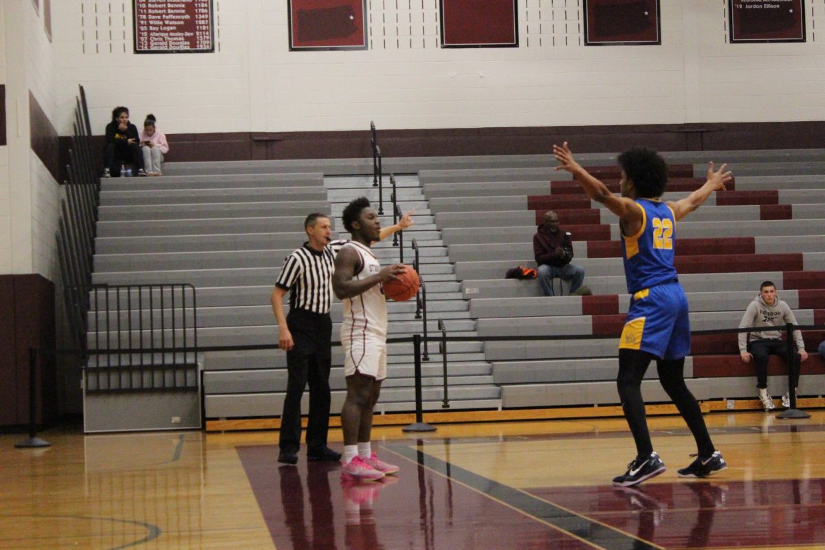 Kameron Knight, '26, inbounding the ball