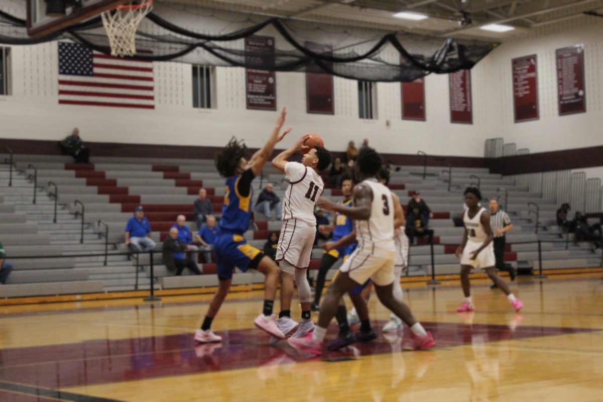 Deon Davis, '26, making a lay up