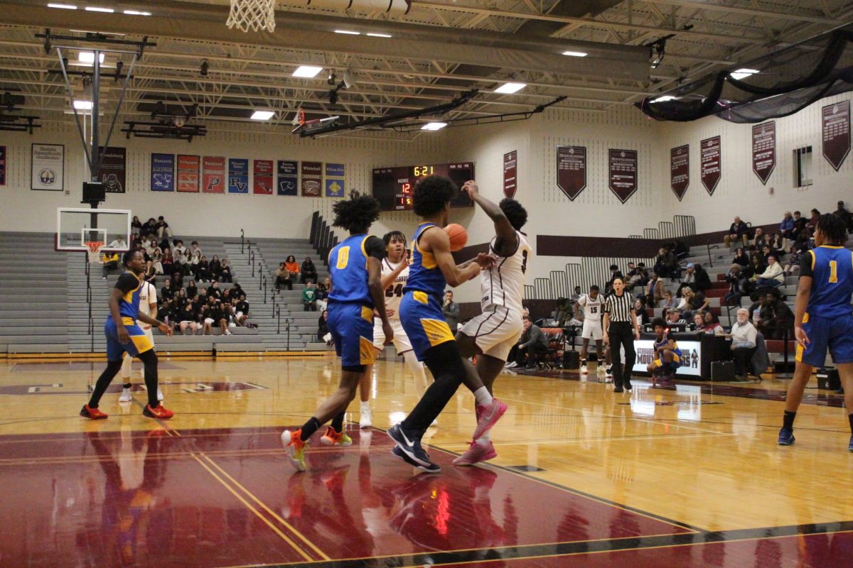 Nazir Williams, '26, making a pass