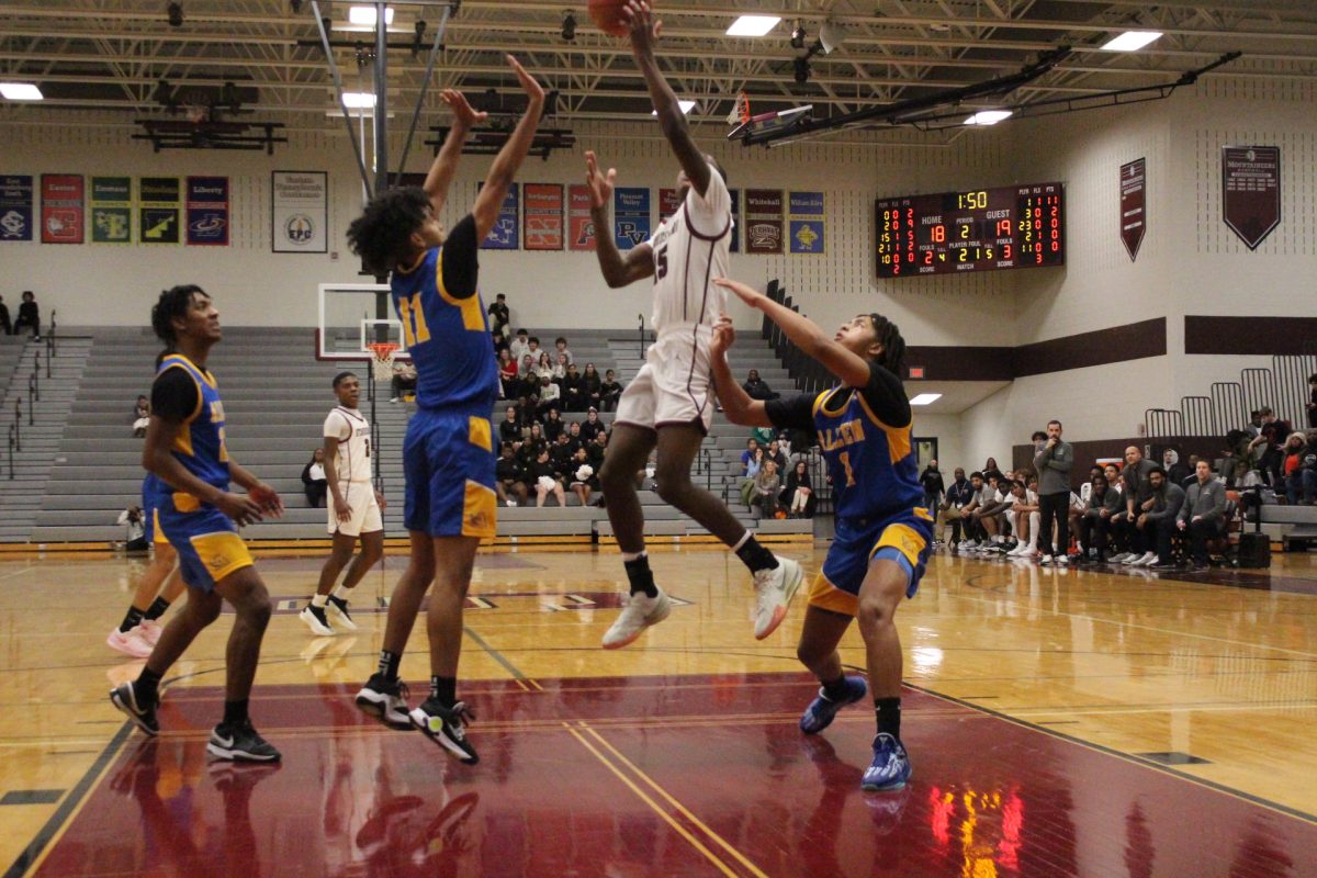 Josh Ivers-Green, '27, making a layup.