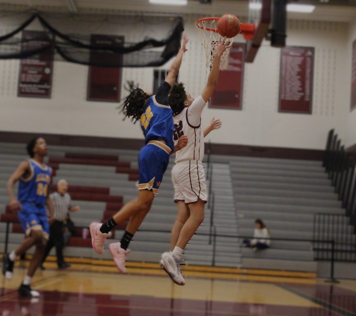 Brandon Quintana, '27, making a layup.