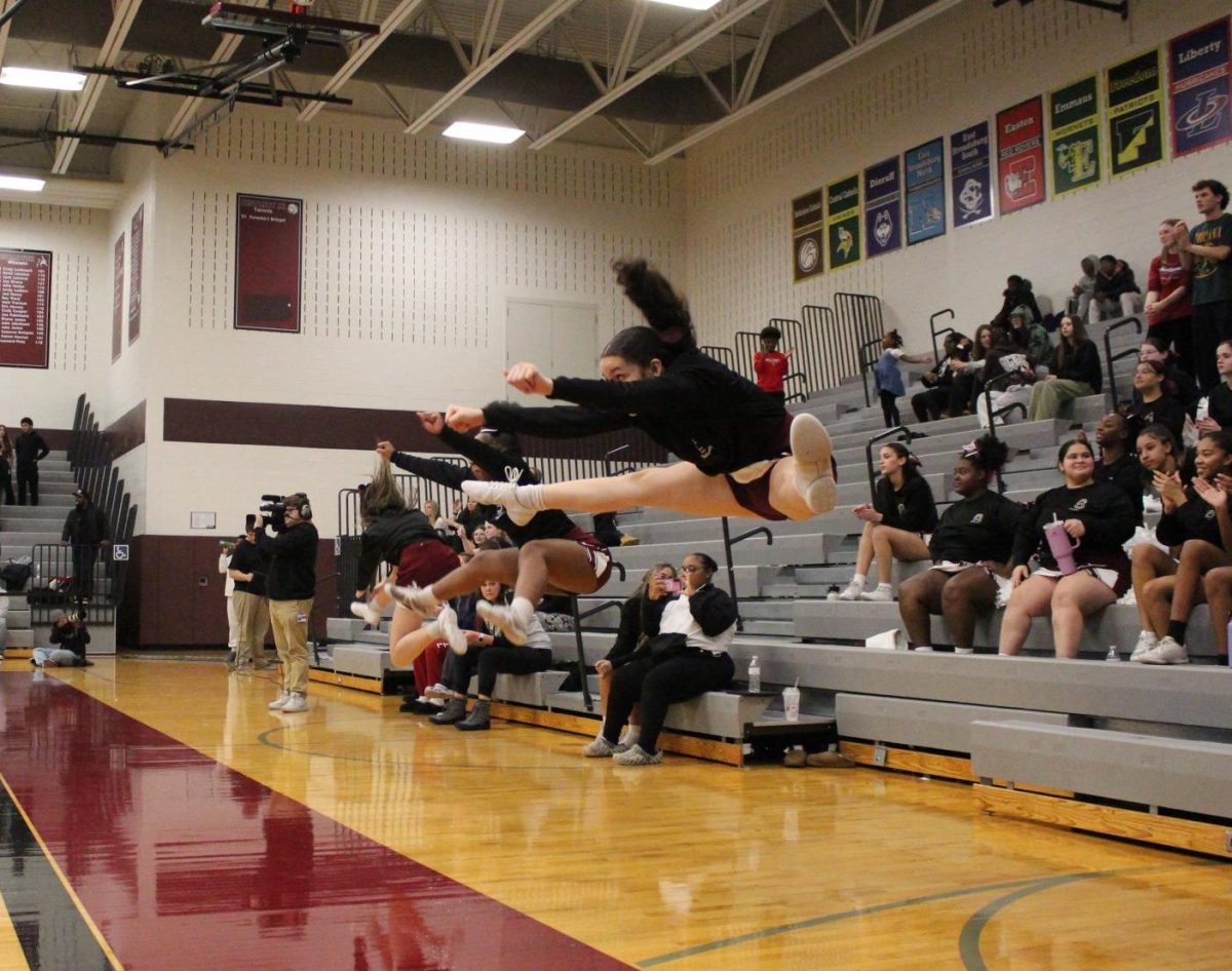 The cheerleaders celebrate after a free throw.