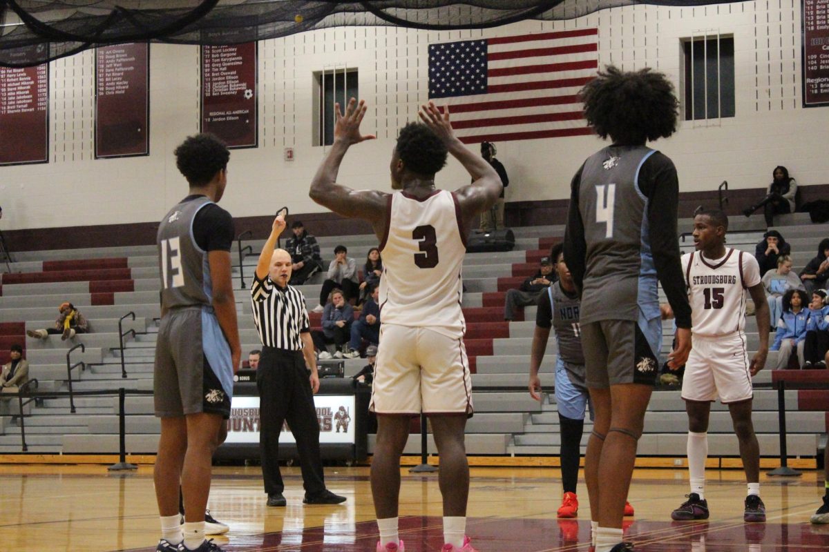 Kameron Knight, '25, calling a play on the free throw line.