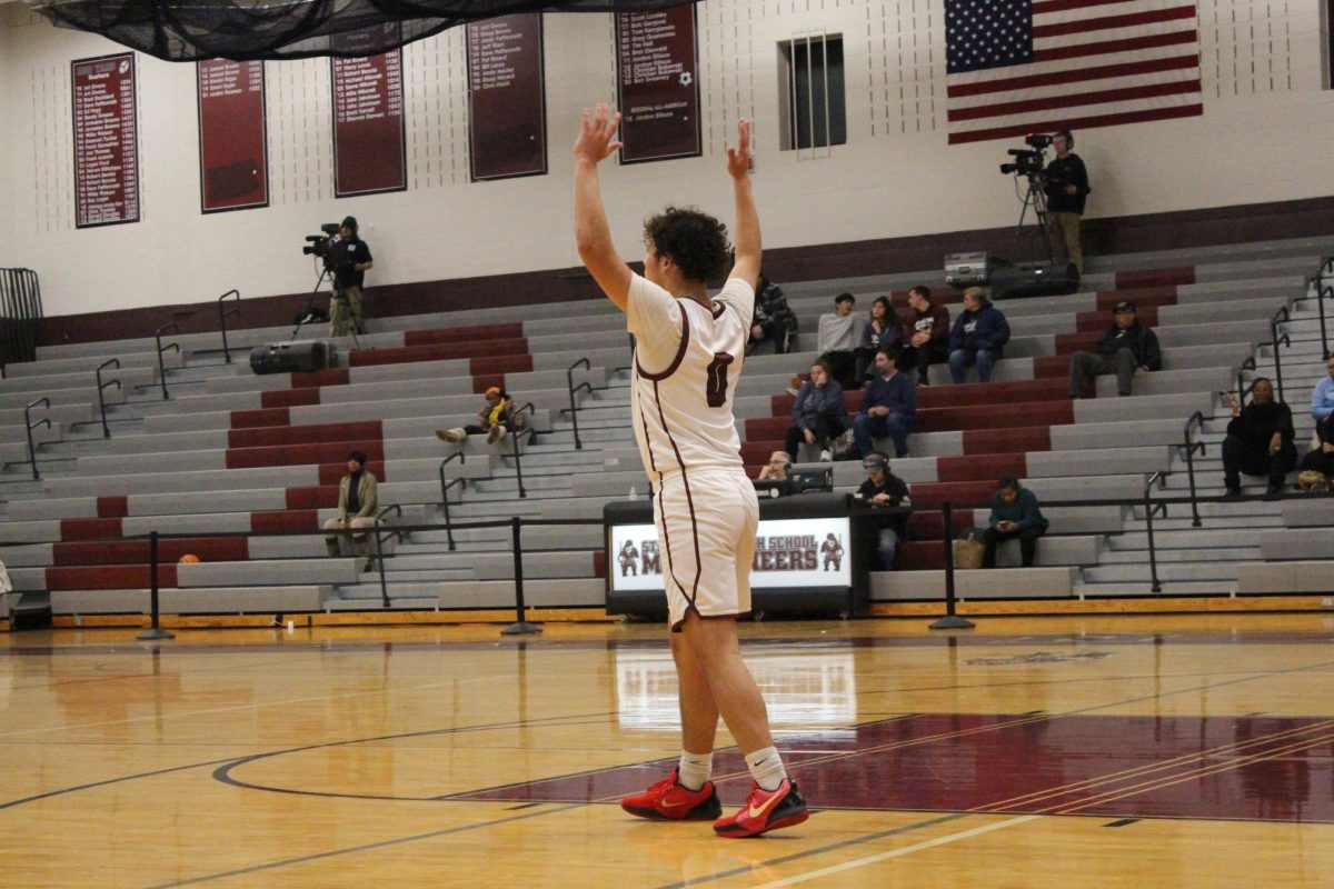 Alex Paciti, '25, calling for the ball down court.