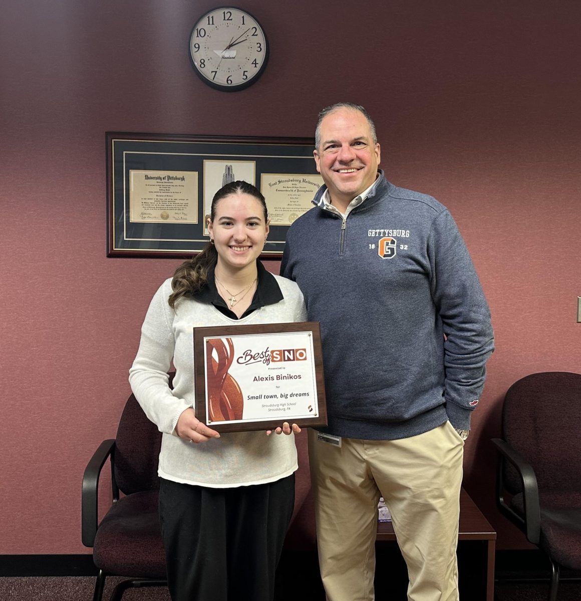 Alexis Binikos poses with Principal Sodl for her journalism award. 