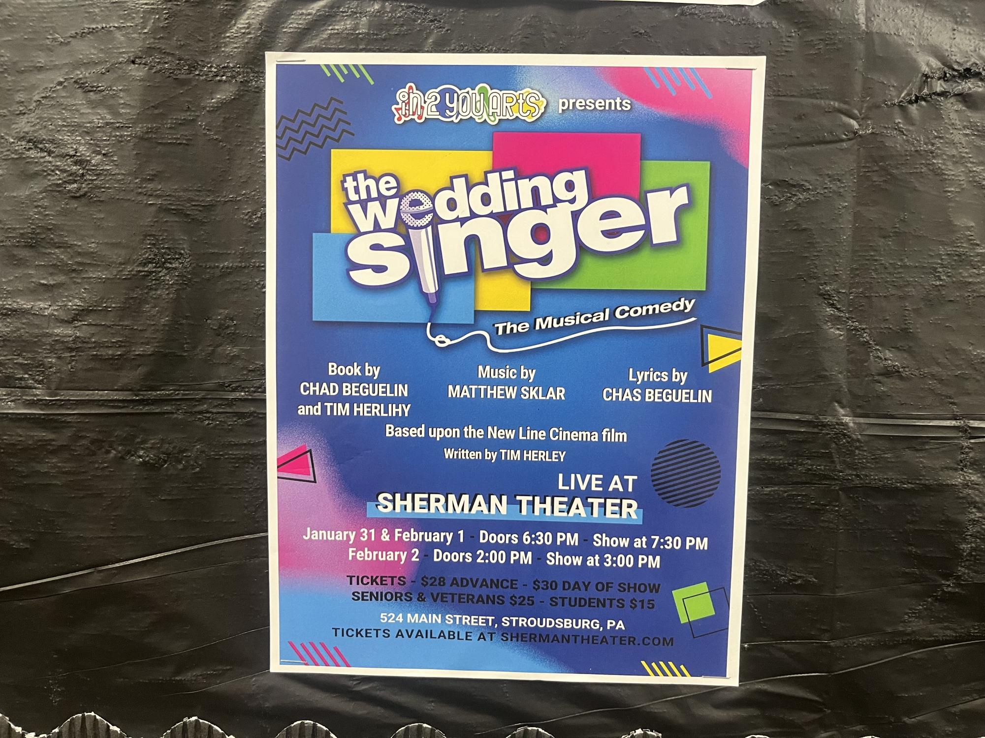 The Wedding Singer poster displayed all over the community