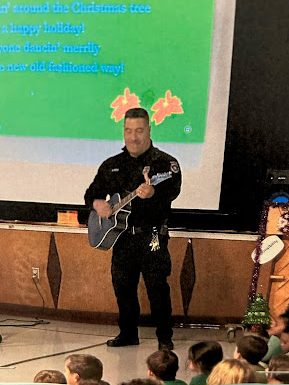 Security Officer Rodriguez performs for the elementary schools before holiday break. Photo provided by A. Rodriguez.