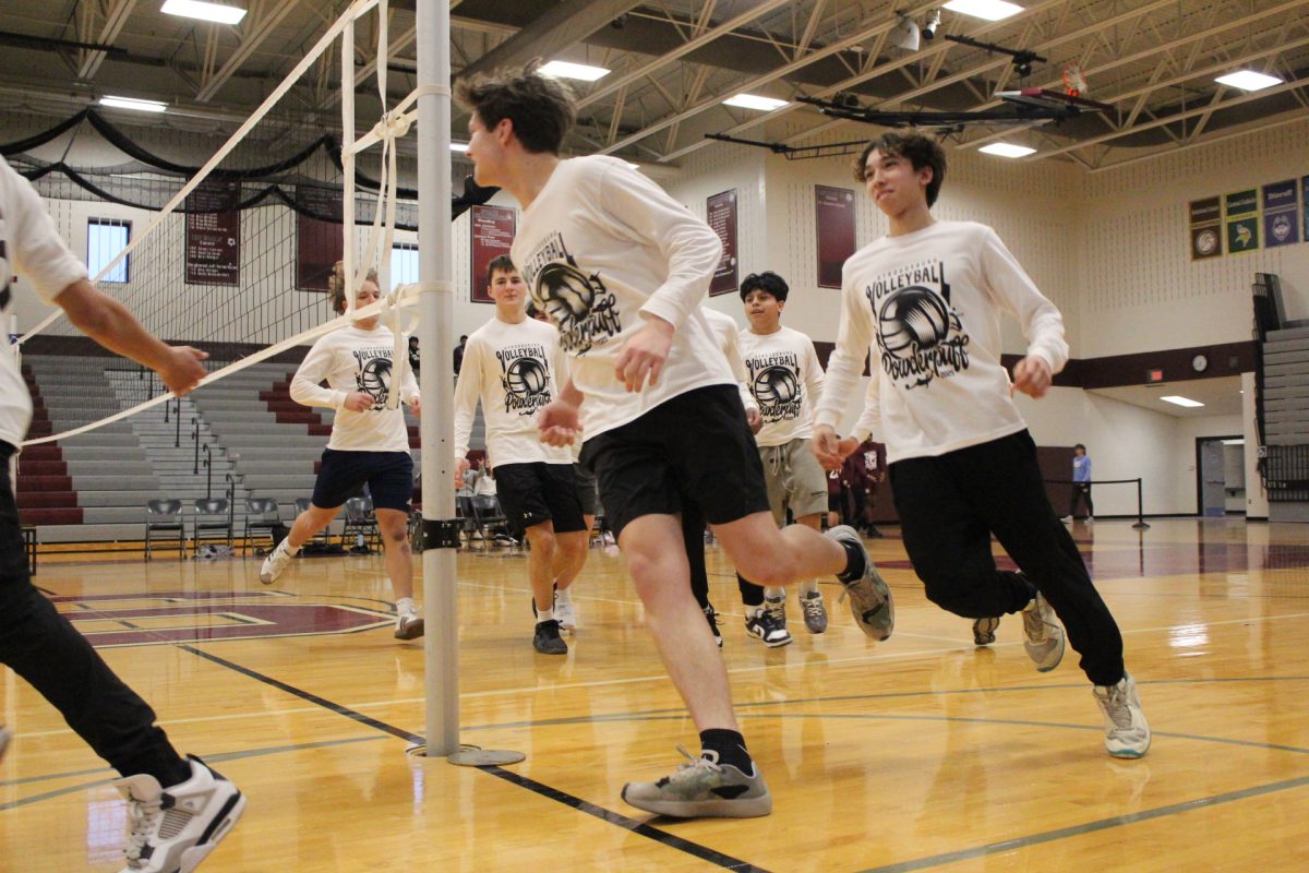 The junior class enters the gym led by A.J. Trifilo and Albert Bialasiewicz. 