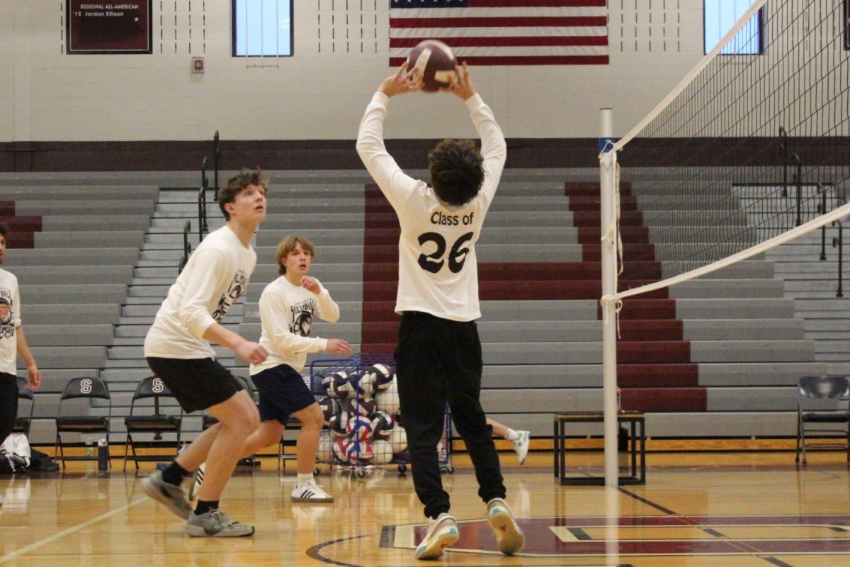 Albert Bialasiewicz, '26, sets the ball.