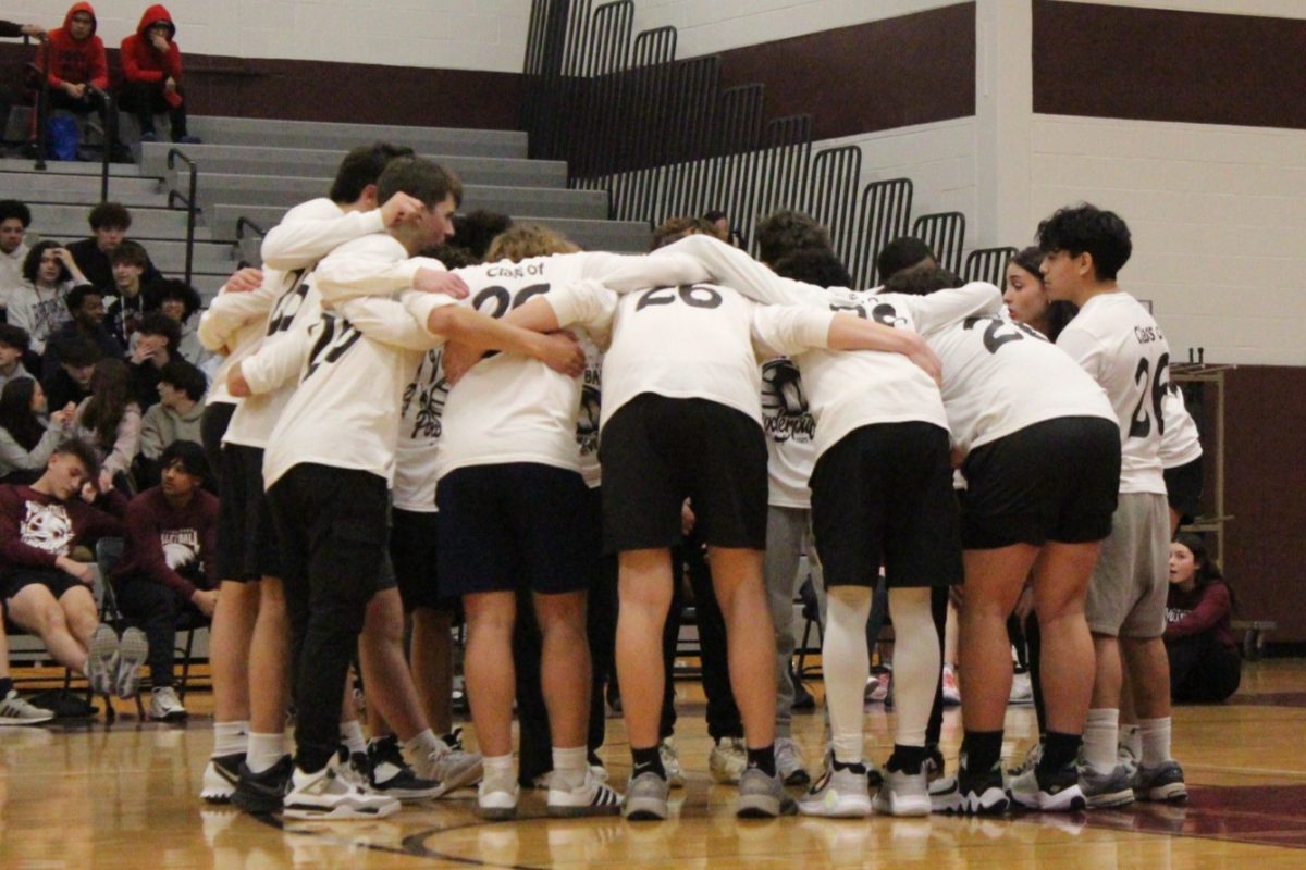 The junior class takes a huddle.