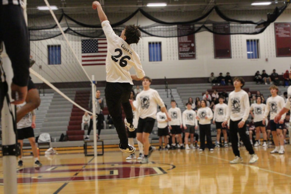 A member of the junior class team blocks the ball.