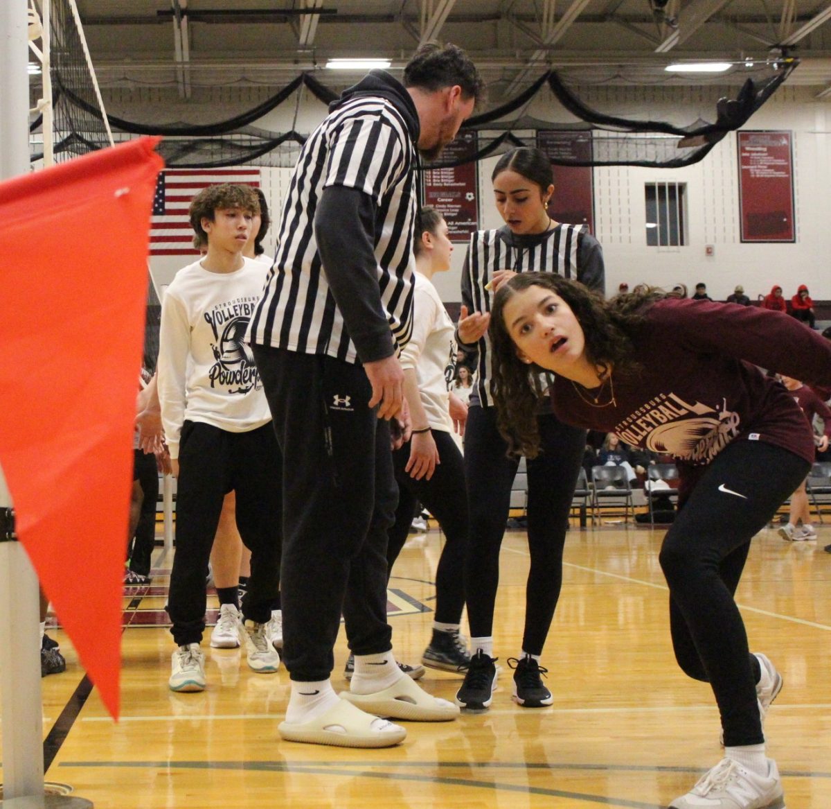 Madelyn Vargas, '27, a sophomore class manager, poses for the camera alongside referees, Jake Cirillo and Sarah Davis. 