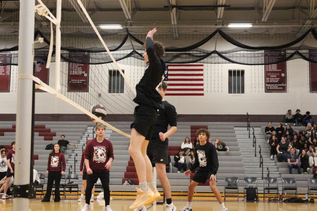 Gavin Bunn, '25, blocks the ball.