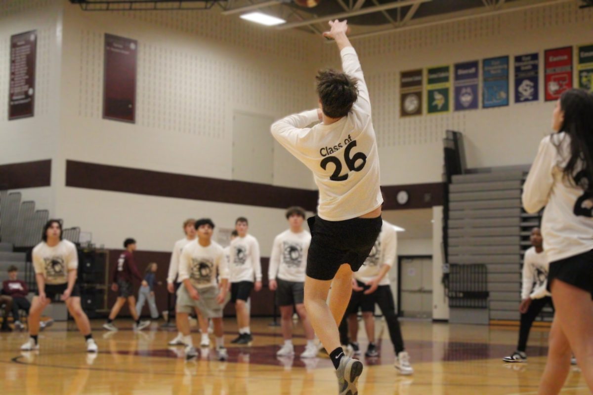 Alvino Trifilo, '26, hits the ball.