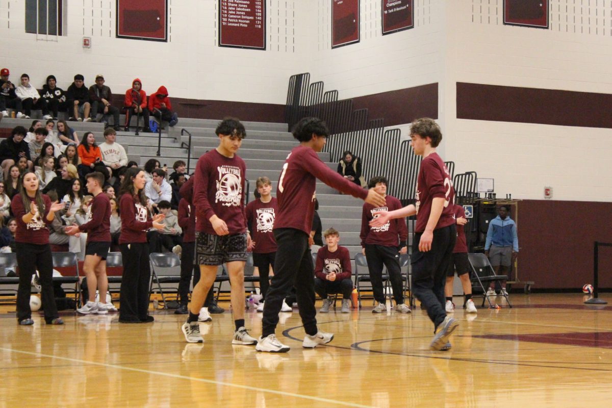 Two members of the sophomore class celebrate a point.