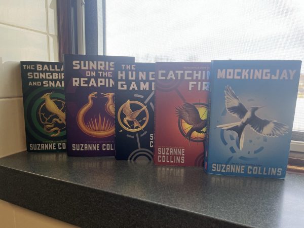 The Hunger Games trilogy, with the light being at the end of Panem and the end of the revolution with "Mockingjay"
