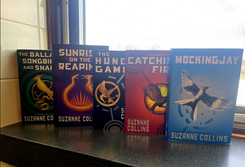 The Hunger Games trilogy, with the light being at the end of Panem and the end of the revolution with "Mockingjay"