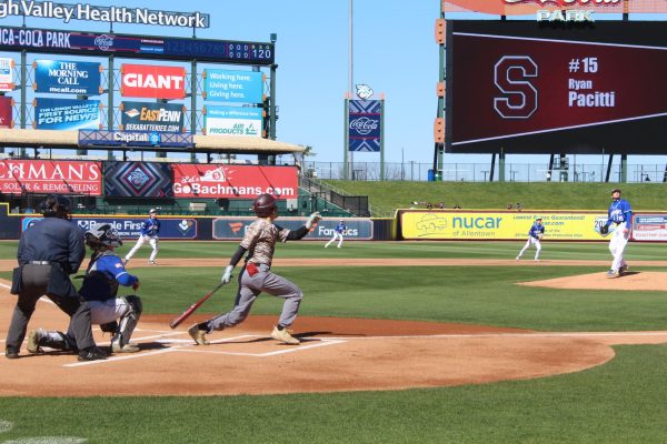 #15, Ryan Pacitti, '27, hitting a fly ball in Coca-Cola Stadium against Pleasant Valley.