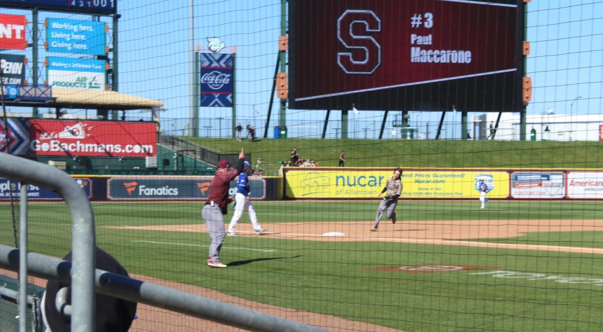 Stroudsburg runner rounding third in game against Pleasant Valley at Coca-Cola Park, home of the Lehigh Valley Iron Pigs.