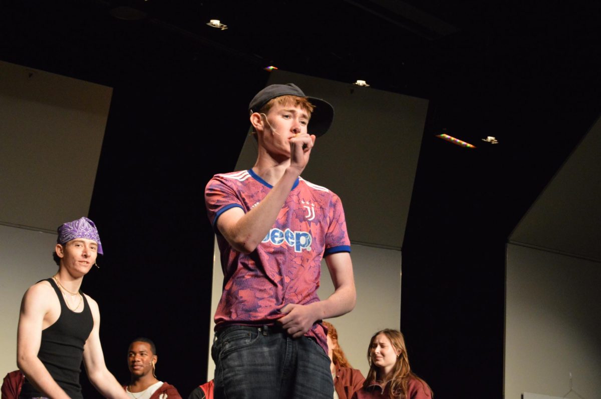 Aiden Coyne, '25, rapping his part in the Left Side Lyricists part of the rap battle.