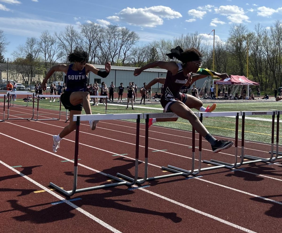 Darrien Burke, '25, catching up to 1st place  in his 110m hurdles race against East Stroudsburg South.