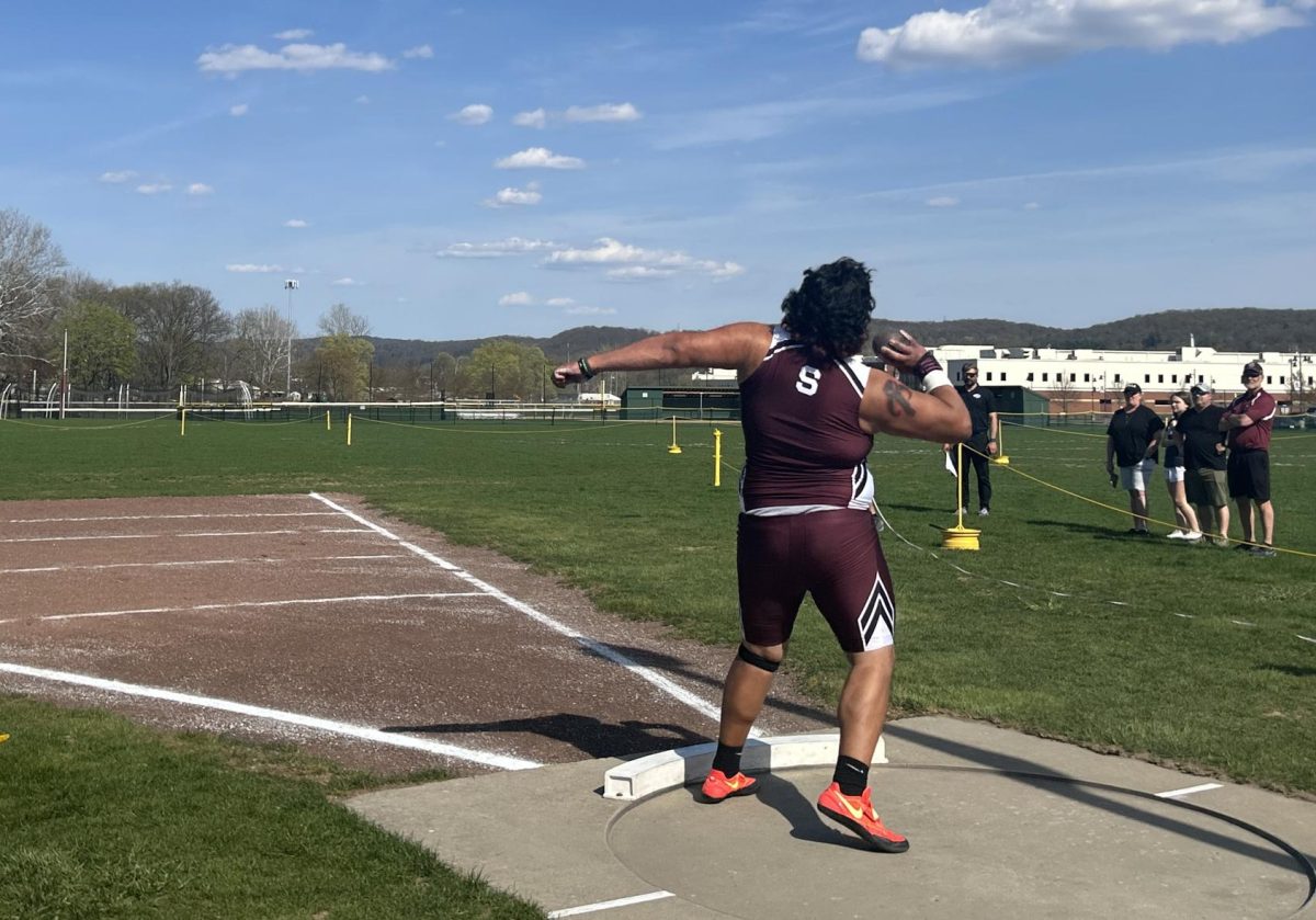 Anthony Delgado, '25, going for his second attempt in his shot put event against East Stroudsburg South.