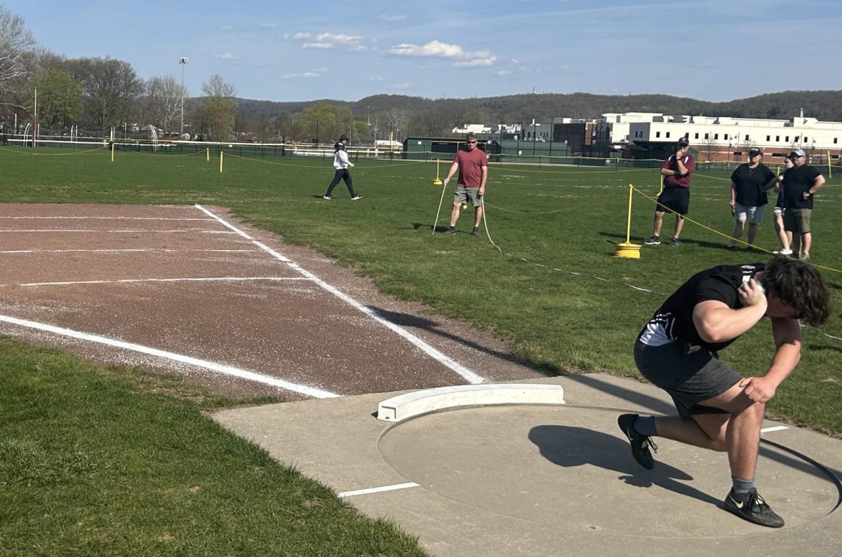Octavian Riszko, '26, preparing to toss his second attempt at shot put against East Stroudsburg South.