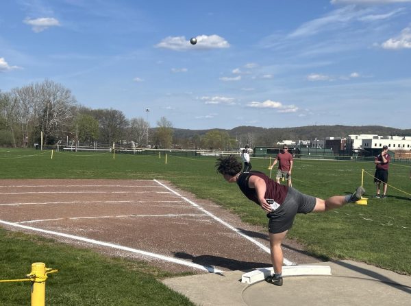 Octavian Riszko, '26, competing in shotput against the Cavaliers. 