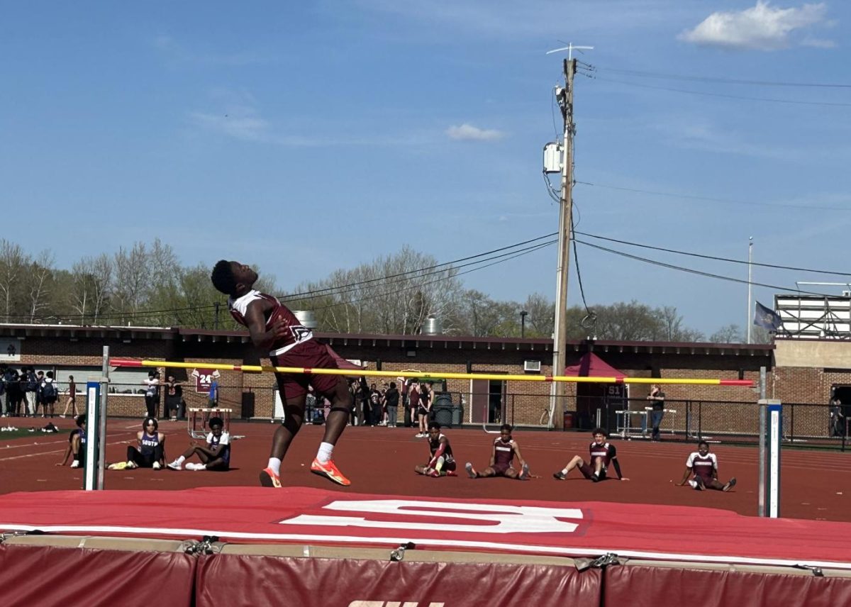 Kameron Knight, '26, clearing the bar in his last high jump attempt against East Stroudsburg South.