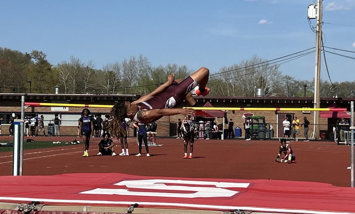 Devin Swen, '25, clearing the bar in his high jump event against East Stroudsburg South.