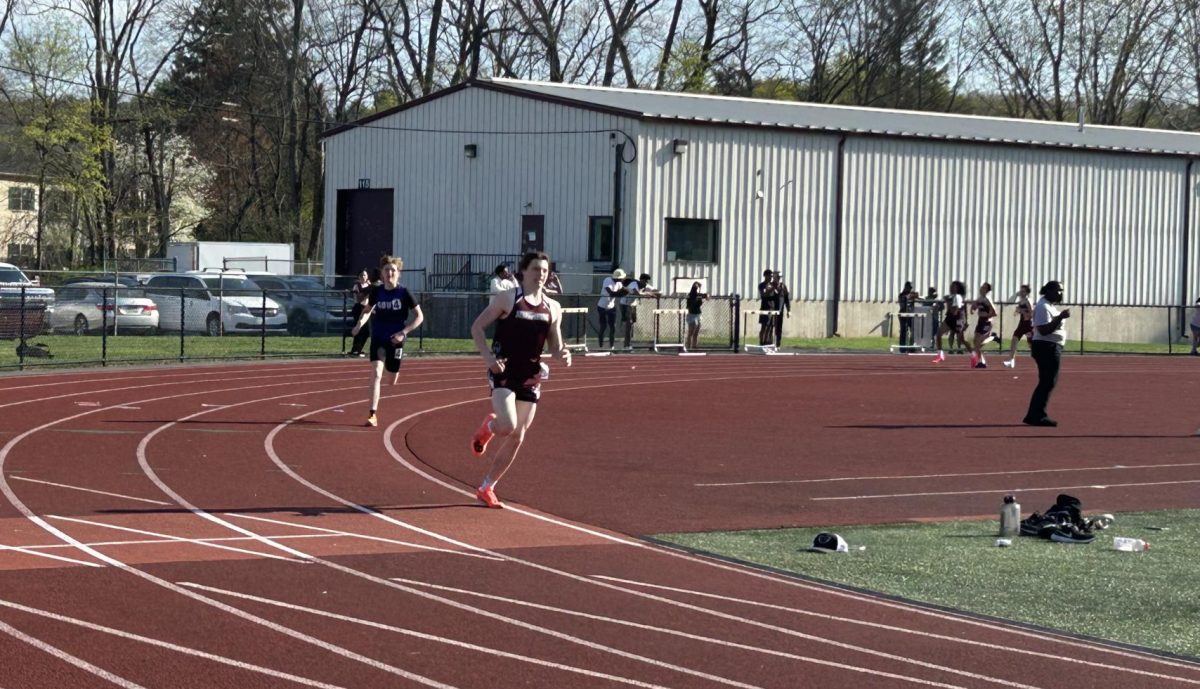 Nico Perini, '25, catching up to 2nd and 1st place in his 800m race against East Stroudsburg South.