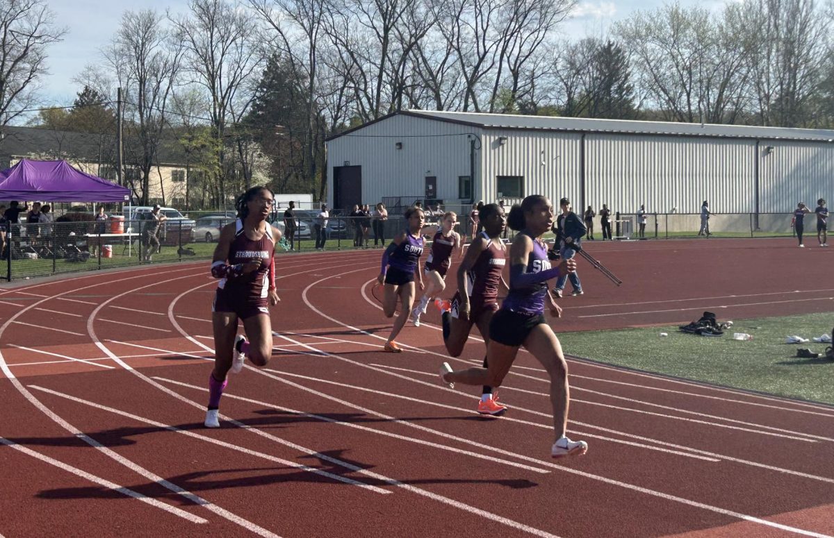 Alena Murray, '25, Julia Grant, '26, catching up to 1st place in his 200m race against East Stroudsburg South.