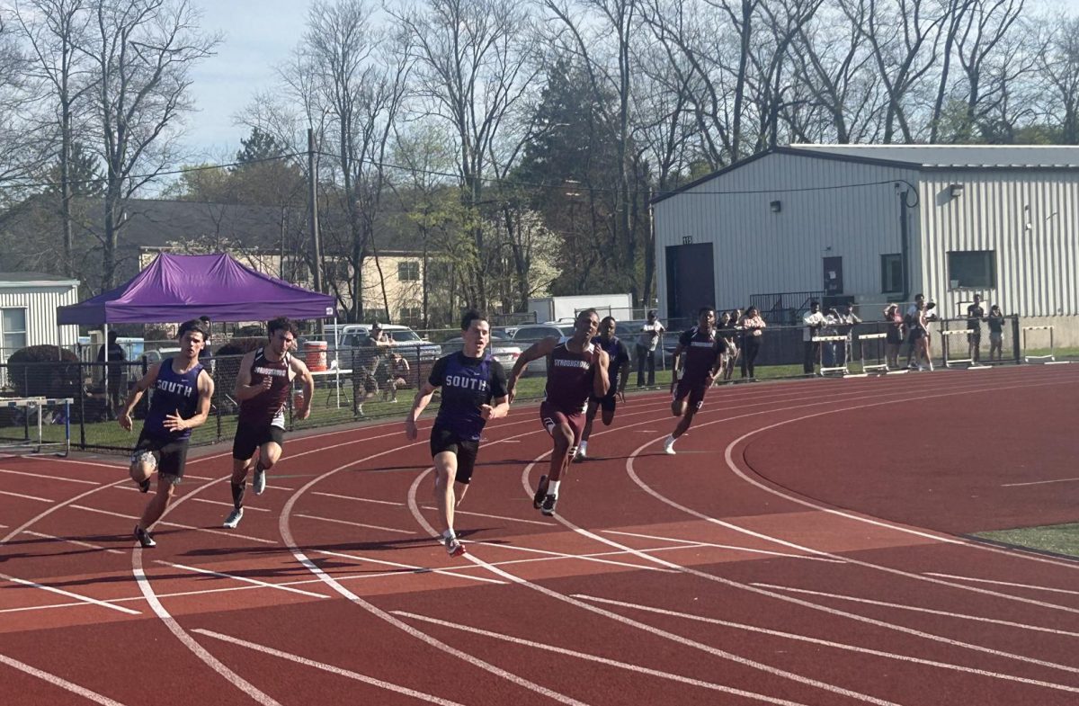 Sergio Teixeira, '26 and Keyen Johnson, '27, fight to earn a higher placement in the 800 sprint.