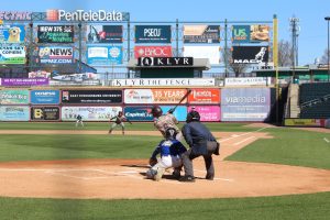 Luke Powanda, '28, striking a ball to center field in game against Pleasant Valley at Coca-Cola Park on April 1, 2025. 