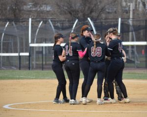 The starting Stroudsburg softball team huddles at the beginning of an inning. Credit to Victoria Lis/yearbook, shared with permission.