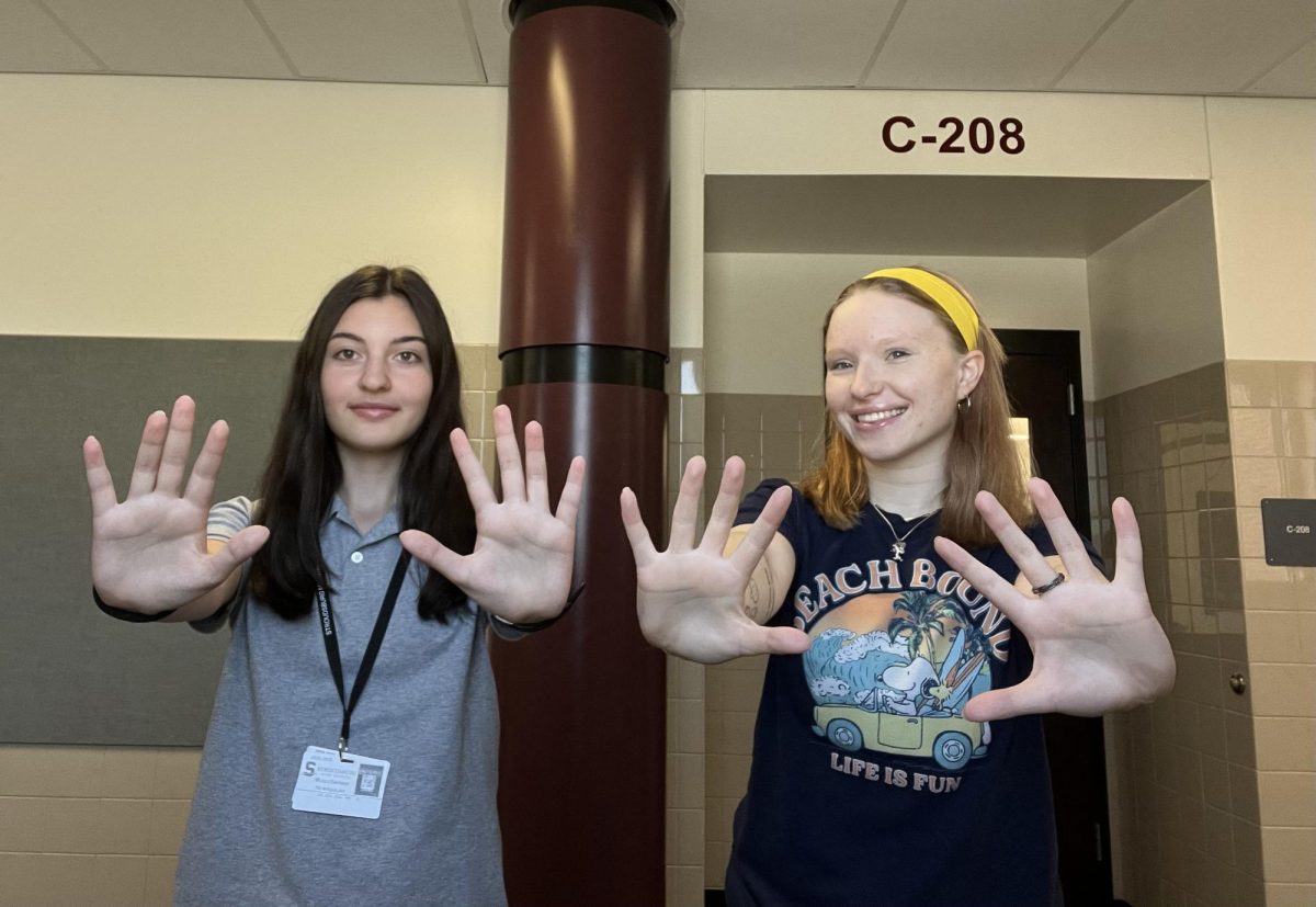Crista Kopec and Lile Bekaia holding up tens for the paper!