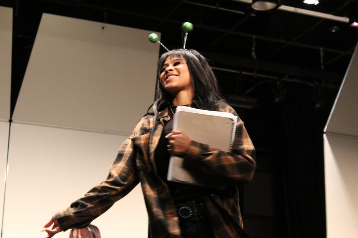 The teacher Mrs. Heller, played by Zsani Findley, '25, smiling once her personality changes from mean to nice. 