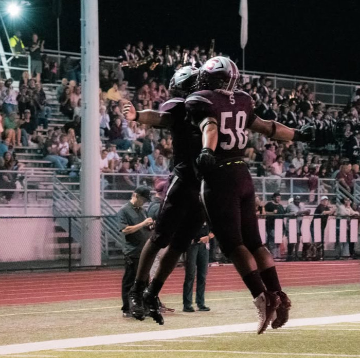 Aren Quintero, '26, and Jaylin Rieara, '26, celebrating a touchdown