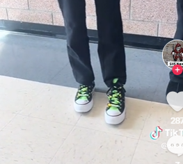 Sky Doll, '27, shows off their custom designed converse shoes. 