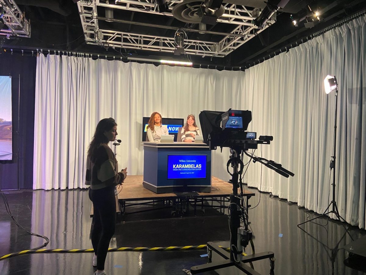 Karen Chapman, '27, and Kiera Paradis, '28, posing for a picture while anchoring at Wilkes University.