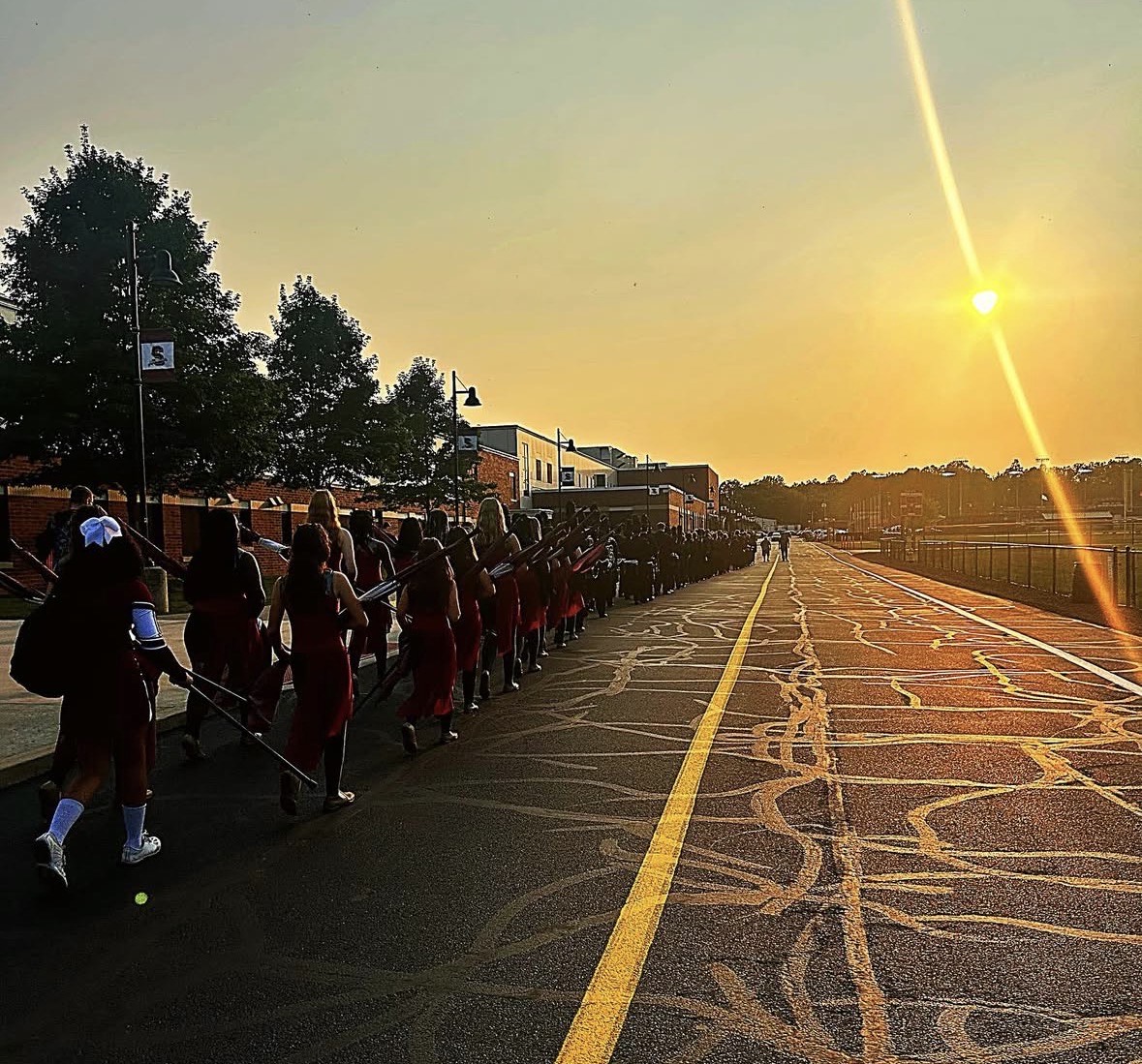 The band marching up to the stadium before the game.