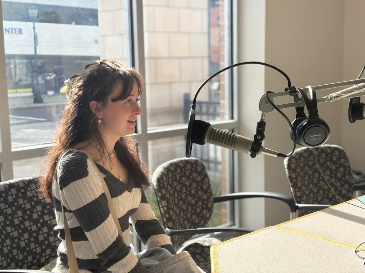 Keira Paradis, '28, talking live in the radio station located at Wilkes University.