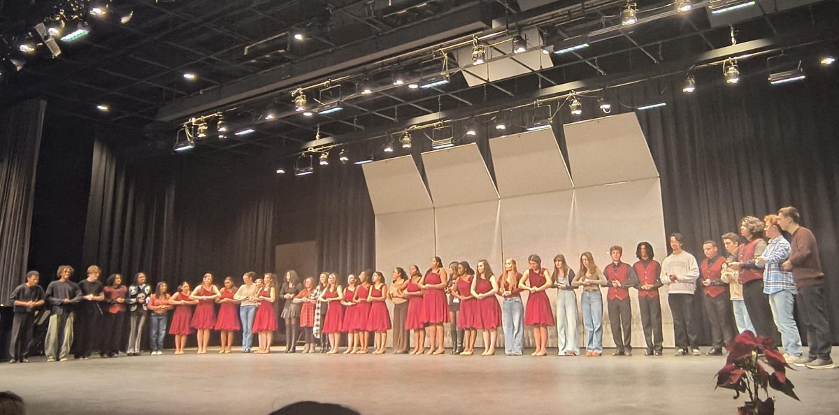 Show Choir performs Fruitcake with the Show Choir Alumni.